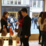 High-quality replica handbags and accessories showcased in a modern urban store