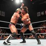 Abyss wrestler displaying strength in a match with fans cheering in the background